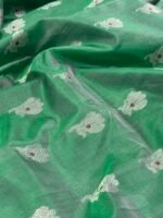 Original Chanderi saree in bottle green with silver zari buti motifs and elegant silver border displayed on a flat surface.