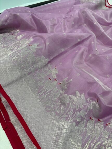 Original Chanderi silk saree in lavender purple with silver zari buti motifs and floral zari border displayed on a flat surface.